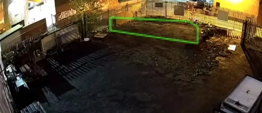 Night camera view of a secured yard